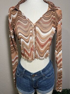 Y2K Retro-inspired long sleeve mesh top from Rue21